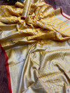 yellow color lichi silk saree with silver zari weaving work