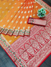 Orange color banarasi soft silk saree with zari weaving work