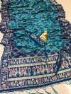 Rama green color bandhani silk saree with golden zari weaving work
