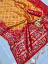 Mustard yellow color bandhani silk saree with golden zari weaving work
