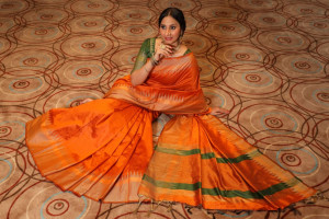 Orange color raw silk weaving saree with temple woven border