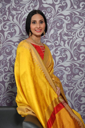 Mustard yellow color raw silk weaving saree with temple woven border