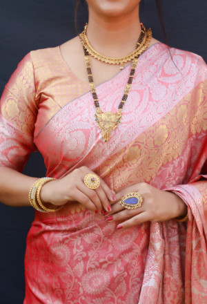 Peach color soft muslin silk saree with woven work