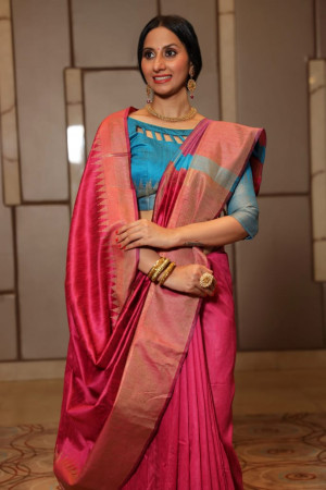 Rani pink color raw silk weaving saree with temple woven border