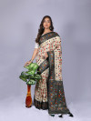 Off white color patola silk saree with printed work