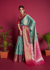Sea green color banarasi  silk saree with zari woven work