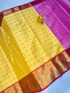 Yellow color tissue silk saree with woven design
