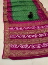 Mahendi green and purple color bandhej silk saree with zari weaving work