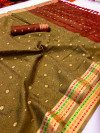 Beige color muslin silk saree with zari woven work