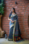 Gray color soft raw silk saree with woven design