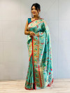 Sea green color paithani silk saree with zari weaving work