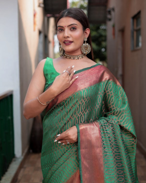 Green color kanchipuram silk saree with zari woven work