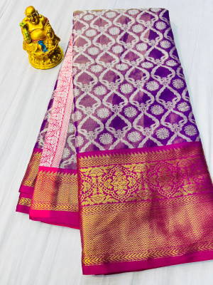 Purple color tissue silk saree with woven design