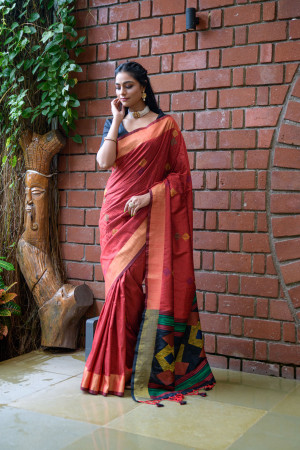 Marron color soft raw silk saree with woven design