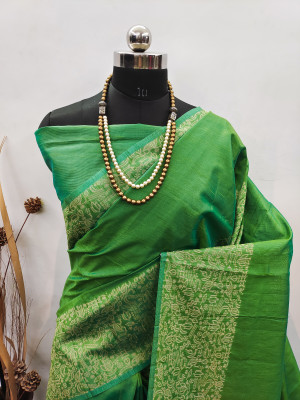 Parrot green color raw silk saree with woven design