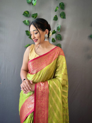 Parrot green color organza silk saree with zari weaving work