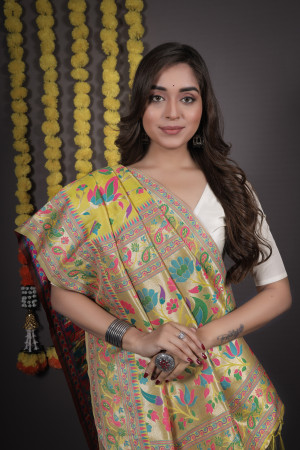 Lemon yellow color paithani silk saree with zari weaving work