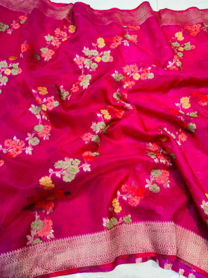 Rani pink color soft organza silk saree with woven design