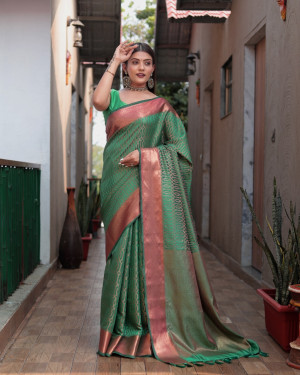 Green color kanchipuram silk saree with zari woven work