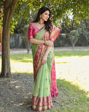 Pista green color soft organza silk saree with woven design