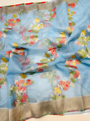 Sky blue color soft organza silk saree with woven design