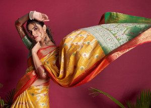 Yellow color banarasi silk saree with zari woven work