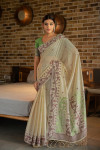 Green color soft modal silk saree with woven design
