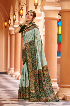 Sea green color patola silk saree with foil printed work