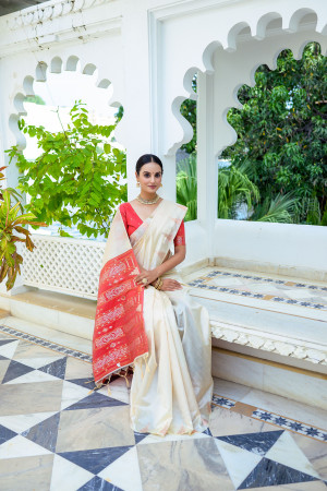 Off white color soft tussar silk saree with zari weaving border