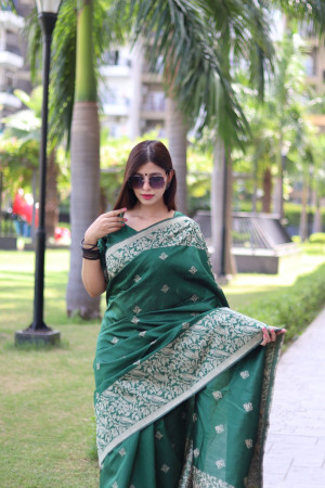 Dark green color soft handloom raw silk saree with weaving work