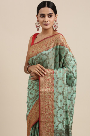 Sea green color katan silk saree with zari woven work