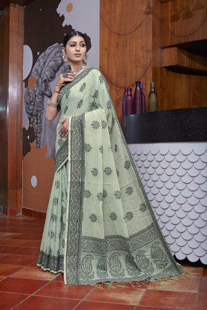 Light pista green color linen cotton saree with woven design