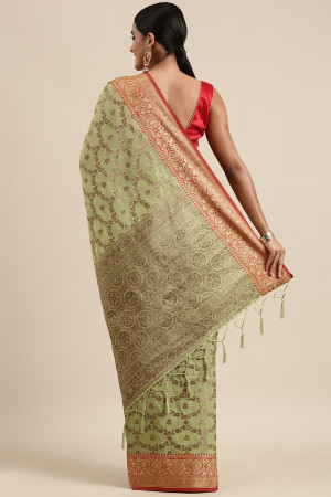 Pista green color katan silk saree with zari woven work
