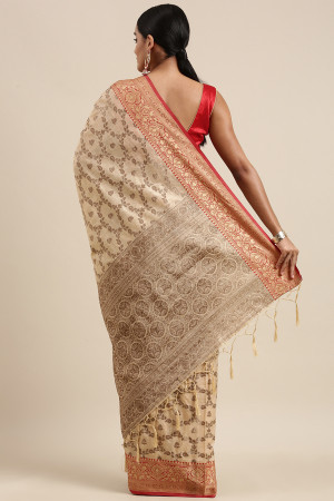 Cream color katan silk saree with zari woven work