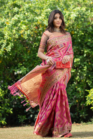 Pink color organza silk saree with zari weaving work