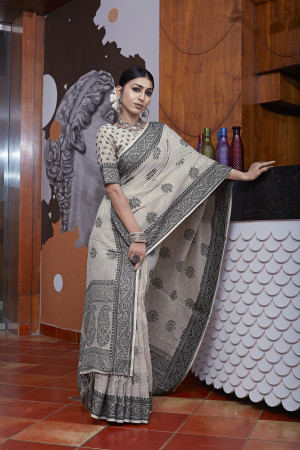 Light off white color linen cotton saree with woven design