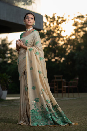 Green color soft modal silk saree with woven design