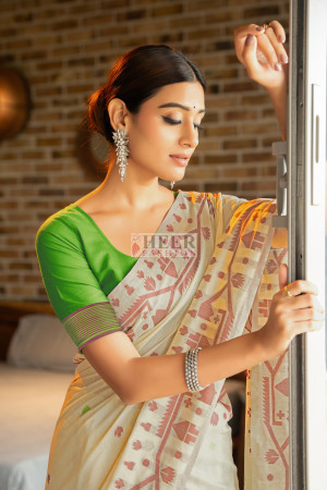 Green color soft modal silk saree with woven design