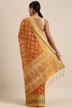 Mustard yellow color soft organza silk saree with woven design