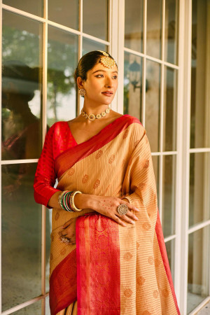 Beige color kanjivaram silk saree with woven design