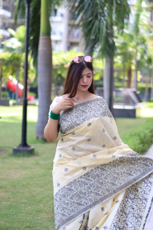 Off white color soft handloom raw silk saree with weaving work