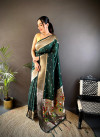 Dark green traditional paithani silk saree with zari weaving work