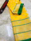 Yellow color lichi silk saree with silver zari work