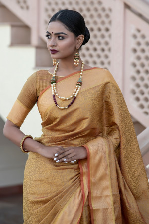 Yellow color soft kanchipuram silk saree with zari border