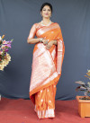 Orange color soft lichi silk saree with silver zari woven work