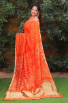 Orange color pure bandhej silk saree with zari weaving work