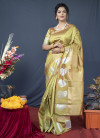 Parrot green color soft linen silk saree with golden zari weaving work