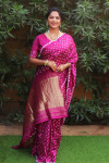 Pink color pure bandhej silk saree with zari weaving work
