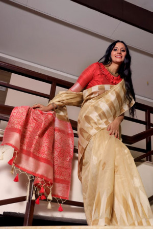 Beige color tussar silk weaving saree with temple woven border