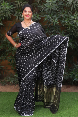 Black color pure bandhej silk saree with zari weaving work